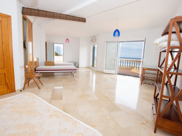 "Stunning sea view from the balcony" "Luxurious pool area for relaxation and entertainment" "Bright and modern kitchen with high-end appliances"